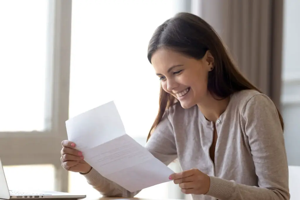 A student reading a scholarship letter